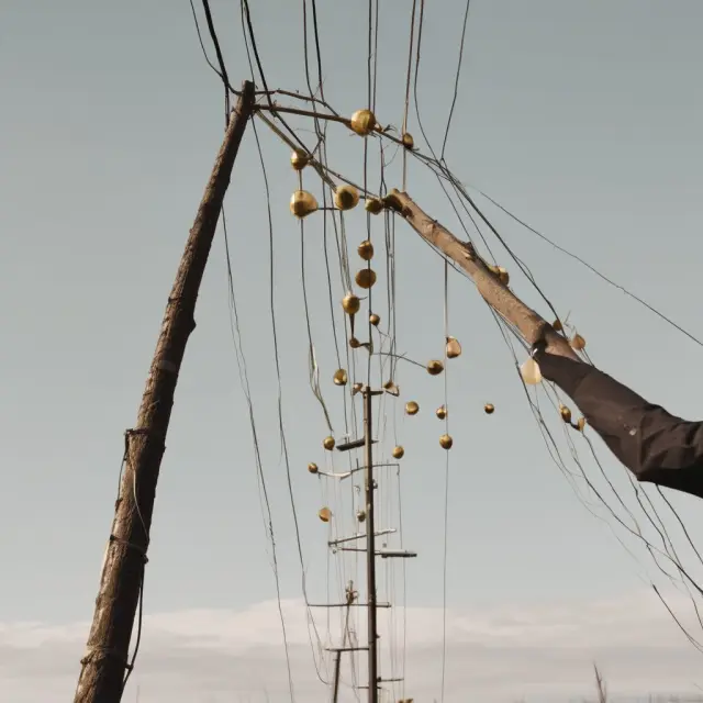 A person skillfully juggles utility poles and a contract, representing the concept of easements in gross
