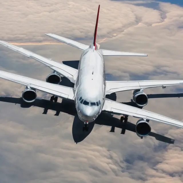 Colorful airlines creating an elastic wave, illustrating price-sensitive consumers and competitors within the airline industry