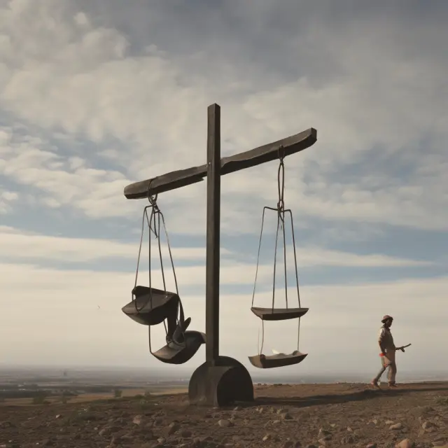 Seesaw depicting labor forces in sending and receiving countries, illustrating the balance of labor supply and demand