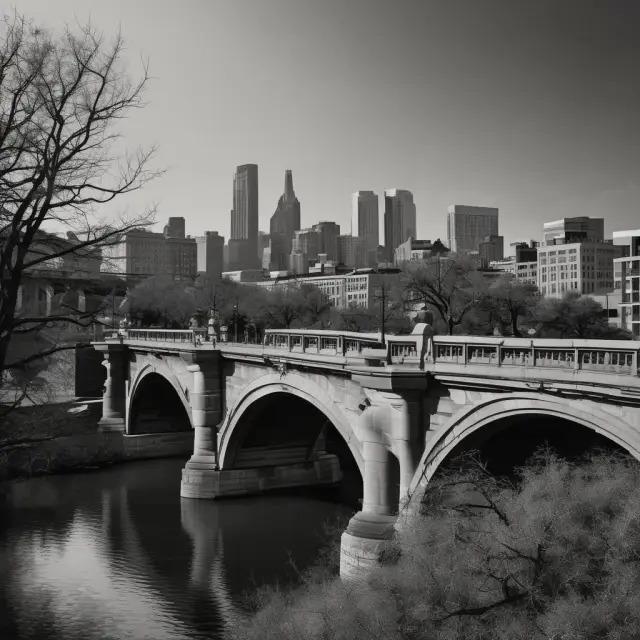 A historic bridge spans the river, surrounded by modern city buildings, illustrating the coexistence of history and progress