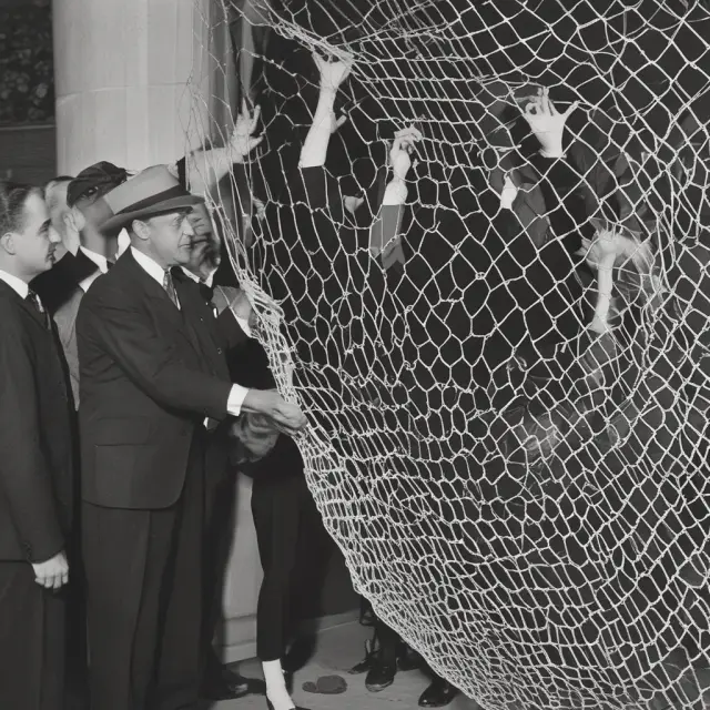 President Franklin D. Roosevelt introduces a safety net with three pillars representing Social Security, WPA, and Fair Labor Standards Act to rebuild America during the Great Depression.
