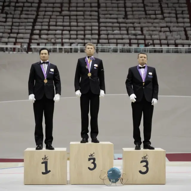 Judges removing extreme values from their scores to calculate a more representative average using the trimmed mean method in sports